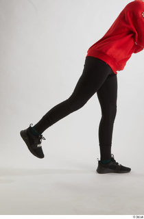 Selin  1 black leggings black sneakers dressed flexing leg…